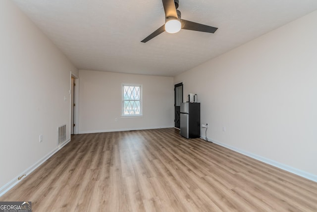 12701 Ga Highway 96 E, Fort Valley, GA 31030 - unfurnished living room featuring light wood-type flooring and ceiling fan