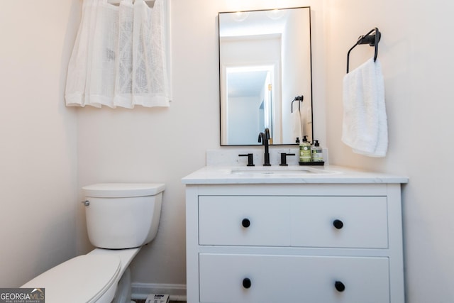 12701 Ga Highway 96 E, Fort Valley, GA 31030 - half bathroom featuring vanity and toilet