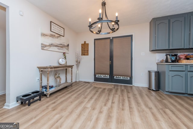 12701 Ga Highway 96 E, Fort Valley, GA 31030 - entryway with french doors, a chandelier, and light wood-style floors