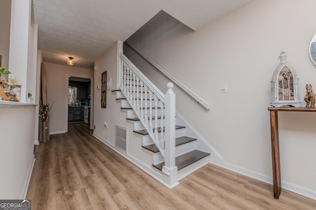12701 Ga Highway 96 E, Fort Valley, GA 31030 - stairway with wood finished floors and baseboards