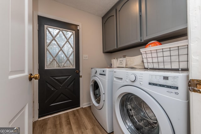 12701 Ga Highway 96 E, Fort Valley, GA 31030 - washroom with separate washer and dryer, cabinet space, wood finished floors, and a textured ceiling