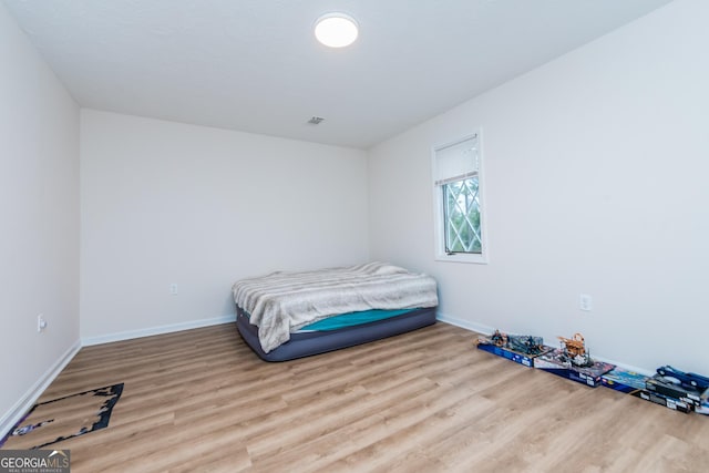 12701 Ga Highway 96 E, Fort Valley, GA 31030 - unfurnished bedroom with wood finished floors and baseboards