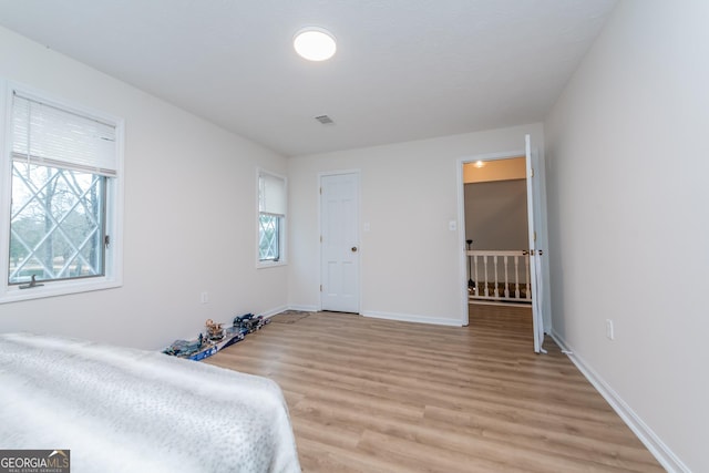 12701 Ga Highway 96 E, Fort Valley, GA 31030 - unfurnished bedroom featuring light wood-style flooring and baseboards