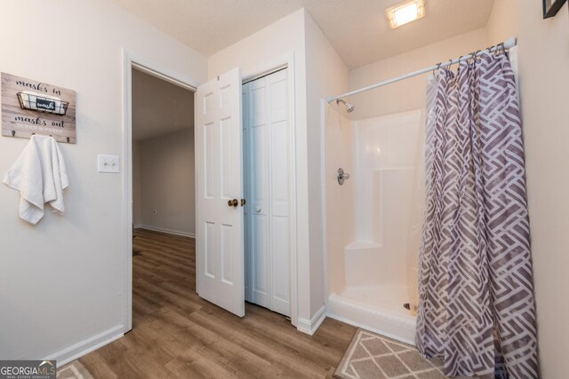 12701 Ga Highway 96 E, Fort Valley, GA 31030 - bathroom featuring wood finished floors and curtained shower
