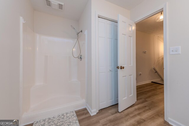 12701 Ga Highway 96 E, Fort Valley, GA 31030 - full bath featuring a closet, wood finished floors, and a shower