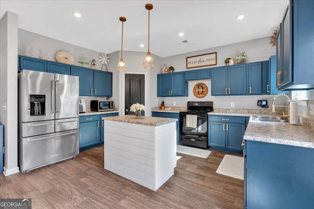 kitchen featuring a sink, light countertops, black range with electric cooktop, high end refrigerator, and blue cabinets