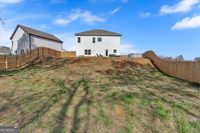 exterior space with a fenced backyard