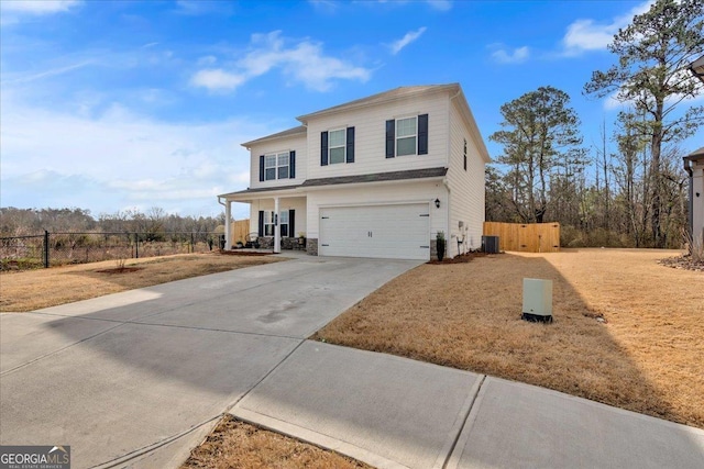 view of front facade featuring driveway, stone siding, fence, a garage, and central AC unit