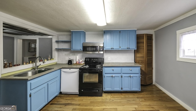 kitchen featuring blue cabinetry, electric range, dishwasher, and stainless steel microwave