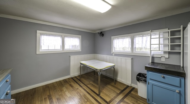 interior space featuring dark wood-style floors and baseboards