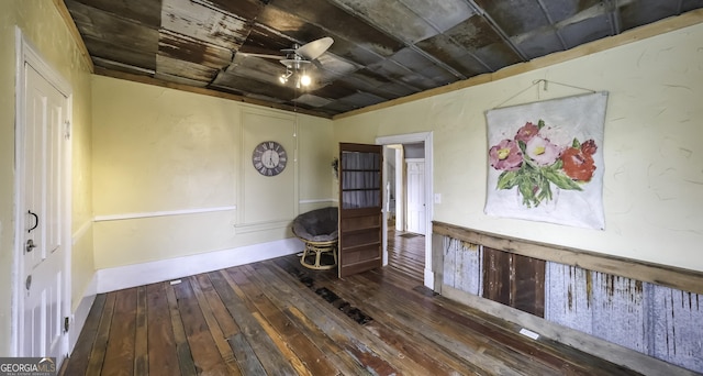 unfurnished room featuring a ceiling fan and wood-type flooring