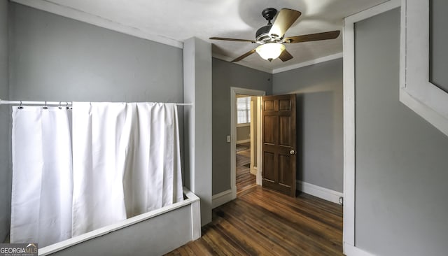 full bathroom featuring a ceiling fan, wood finished floors, and baseboards