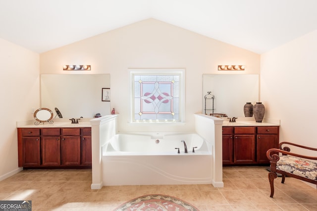 full bathroom with lofted ceiling, two vanities, and a sink