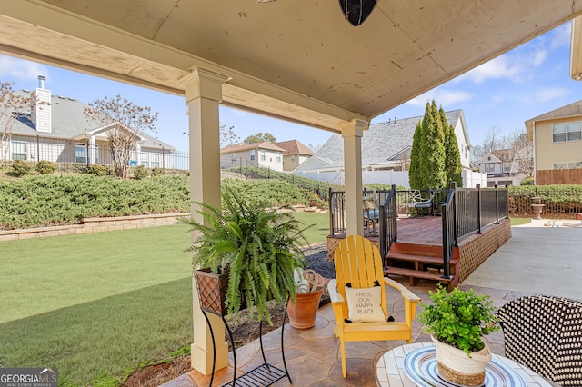 view of patio featuring fence