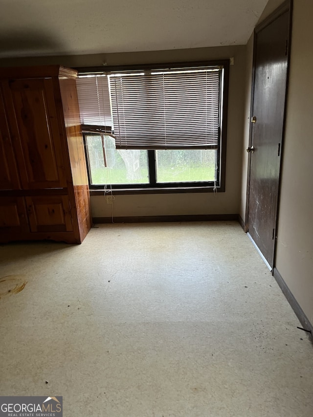 109 E Main St, Manchester, GA 31816 - spare room featuring baseboards and a healthy amount of sunlight
