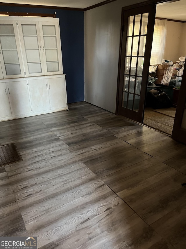 unfurnished room featuring dark wood-style floors and french doors