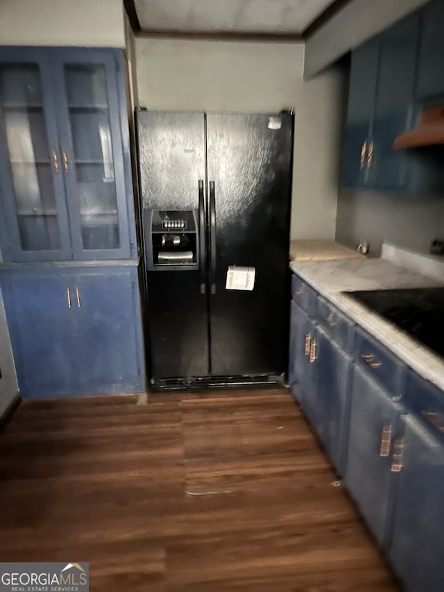 kitchen featuring blue cabinetry, black appliances, dark wood-style flooring, and light countertops