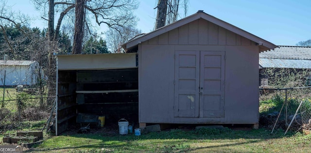 view of shed with fence