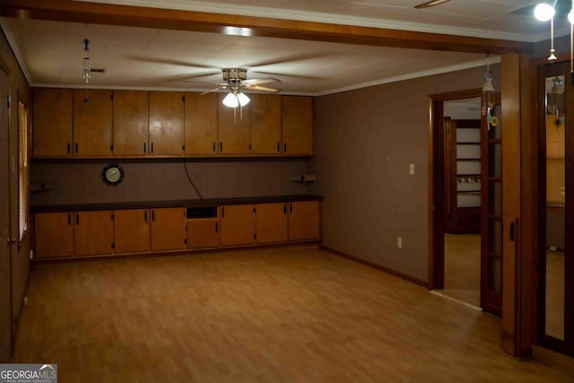 kitchen with brown cabinets, crown molding, light wood-style floors, and ceiling fan