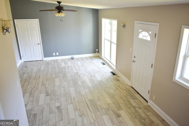 110 Wildwood Cir, Gainesville, GA 30501 - entryway featuring baseboards, visible vents, light wood finished floors, ceiling fan, and vaulted ceiling