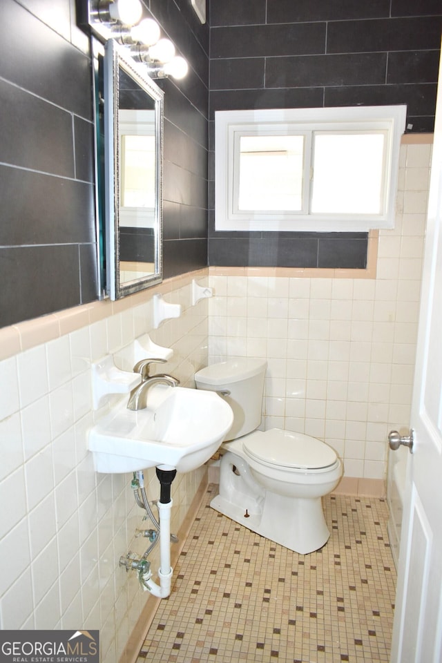 110 Wildwood Cir, Gainesville, GA 30501 - bathroom with tile walls, toilet, and a healthy amount of sunlight