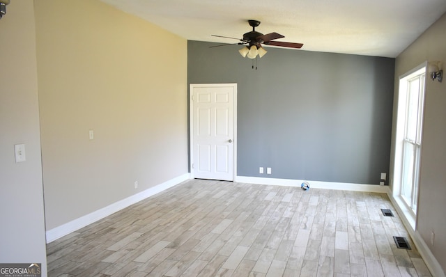 110 Wildwood Cir, Gainesville, GA 30501 - spare room with baseboards, visible vents, lofted ceiling, light wood-style flooring, and ceiling fan