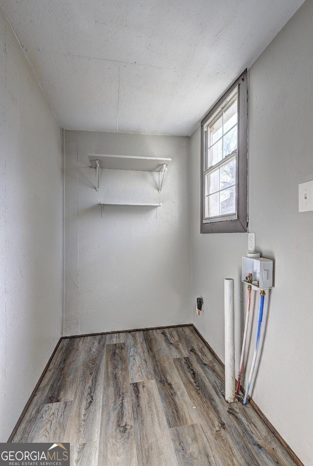 empty room with wood finished floors