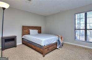 carpeted bedroom with baseboards