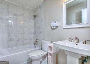 full bath featuring toilet and shower / bathing tub combination