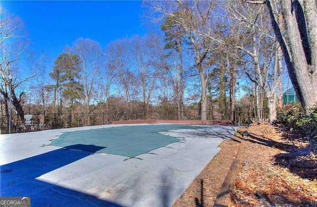 view of swimming pool with a fenced in pool and fence