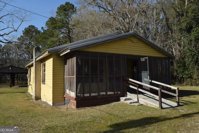 exterior space featuring a sunroom