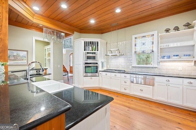 kitchen featuring a warming drawer, ornamental molding, a sink, tasteful backsplash, and wooden ceiling