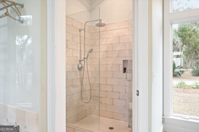 bathroom with a tile shower