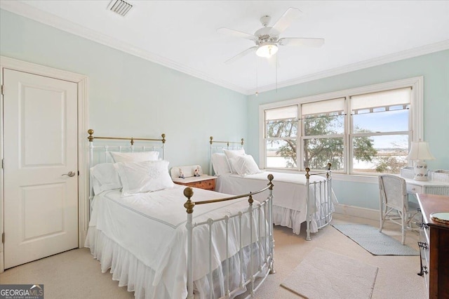 bedroom featuring ceiling fan, visible vents, light carpet, and ornamental molding
