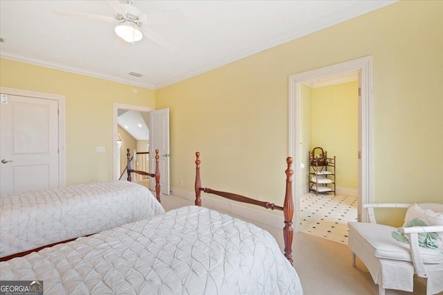 carpeted bedroom featuring visible vents, baseboards, and ornamental molding