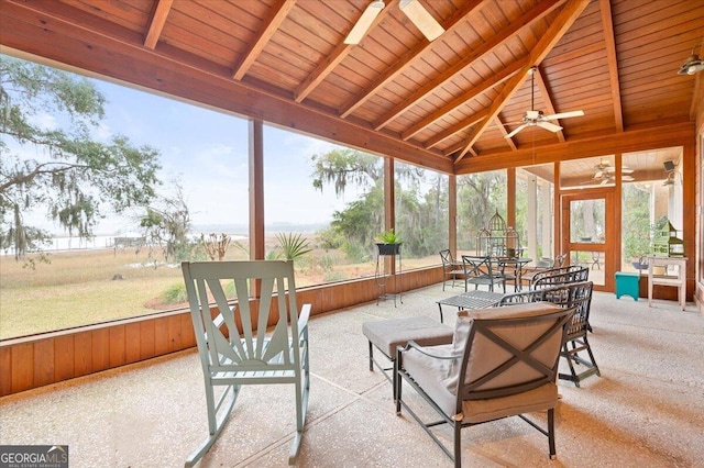 sunroom with wooden ceiling, vaulted ceiling with beams, and ceiling fan