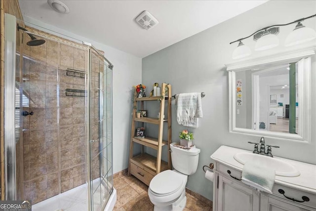 full bath with visible vents, a stall shower, toilet, and vanity