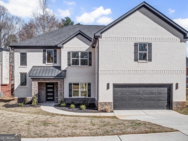 view of front of home with a standing seam roof, concrete driveway, an attached garage, metal roof, and brick siding