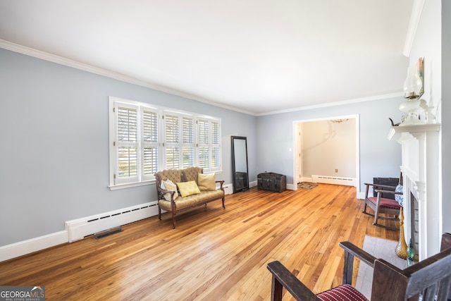 living area featuring baseboard heating, light wood-type flooring, and ornamental molding