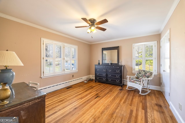 living area featuring ornamental molding, a ceiling fan, light wood finished floors, a baseboard radiator, and baseboards