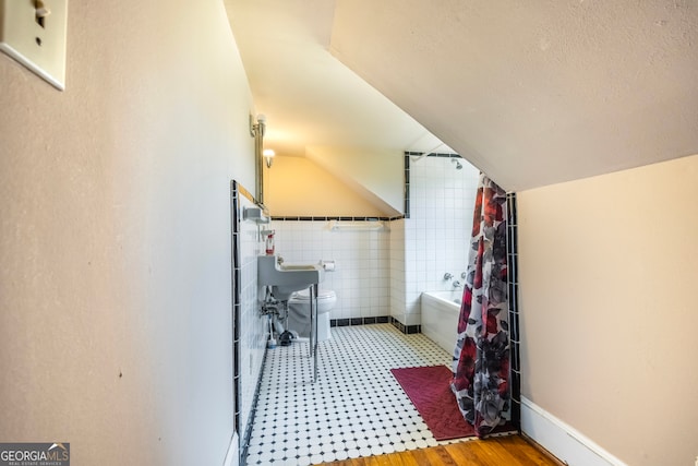 interior space featuring lofted ceiling and a textured ceiling