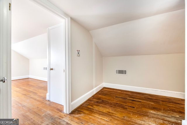 bonus room featuring visible vents, wood-type flooring, and baseboards