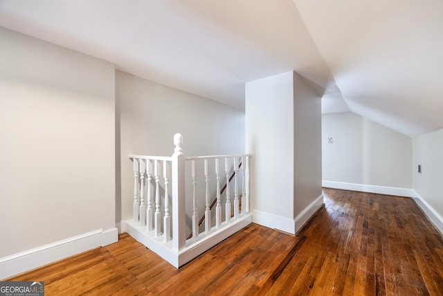 bonus room with baseboards, wood-type flooring, and lofted ceiling