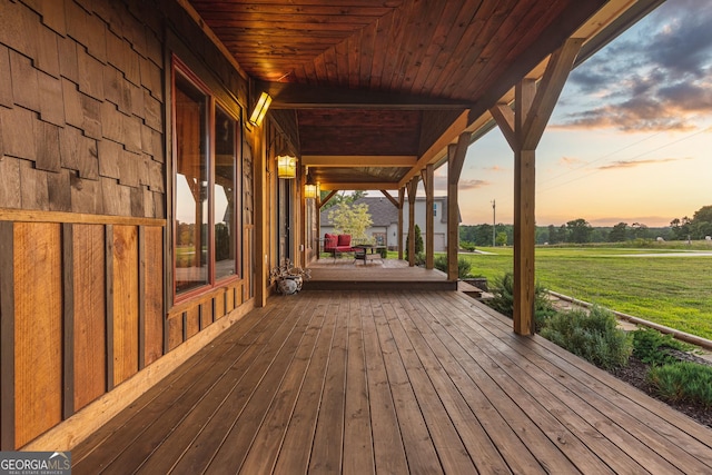 wooden terrace with a yard