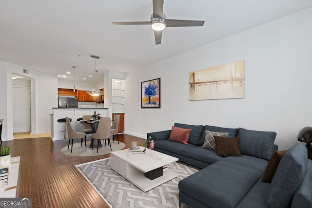 living room with visible vents, dark wood-type flooring, baseboards, recessed lighting, and a ceiling fan