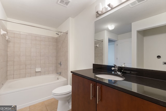 full bath with tile patterned flooring, toilet, vanity, and visible vents