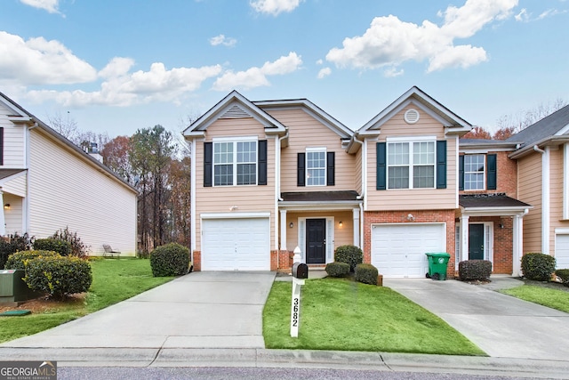 3682 Harvest Dr, Decatur, GA 30034 - view of front of home featuring driveway, brick siding, an attached garage, and a front yard