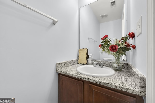 bathroom featuring vanity and visible vents