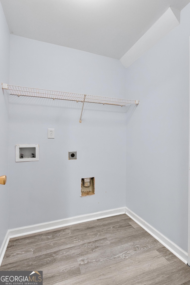 laundry area featuring washer hookup, laundry area, wood finished floors, and hookup for an electric dryer