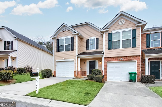 traditional-style home with a front lawn, an attached garage, brick siding, and driveway